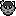 A scruffy grey cat with multiple dark markings on its head, its right ear chipped, and its left ear pointed downwards.